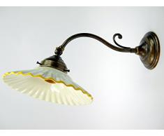 Applique ottone brunito appliques liberty piatto ceramica lampada parete am28.Dimensioni: Altezza15cm,diametro vetro 19cm,sporgenza max 35cm,diametro base10cm.Le dimensioni sono comprensive del piatto.Portalampade attacco Edison E14 (attacco piccolo).