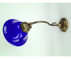 Applique in ottone brunito,appliques stile liberty con vetro bombato blu,lampada parete da interno am21.Dimensioni: Sporgenza come da foto 40cm,diametro vetro 19cm, Diametro base 9,5cm.Portalampade attacco Edison E14 attacco piccolo.