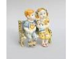 Ceramiche Caltagirone Bimbi su panca in ceramica di Caltagirone